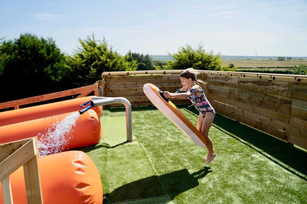 Young Girl About to Slide Down the 350ft Giant Inflatable Slide at Cornwall Slip and Slide