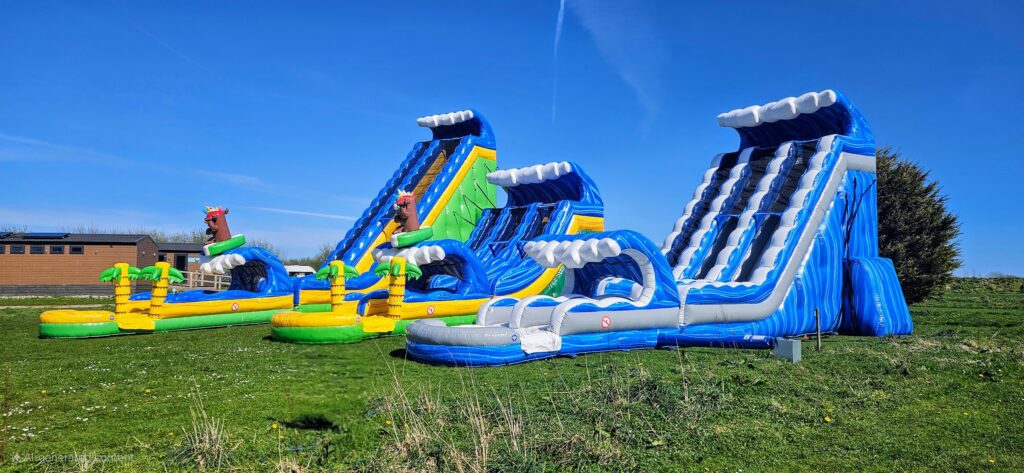 Giant inflatable slides and water park at Cornwall Slip and Slide, Atlantic Reach Resort near Newquay
